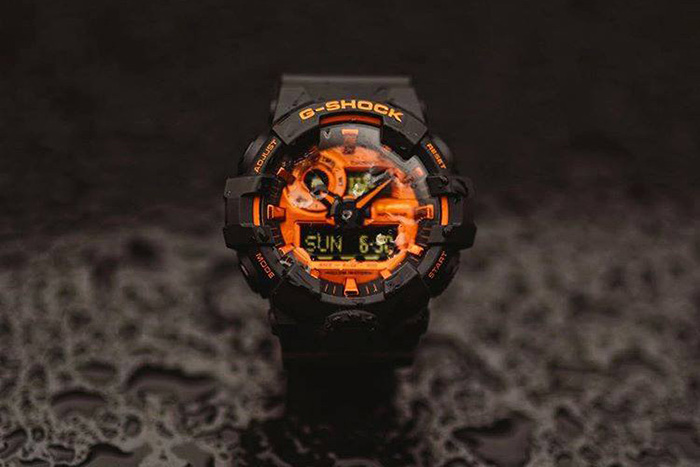 黑色和橙色卡西欧G电击手表